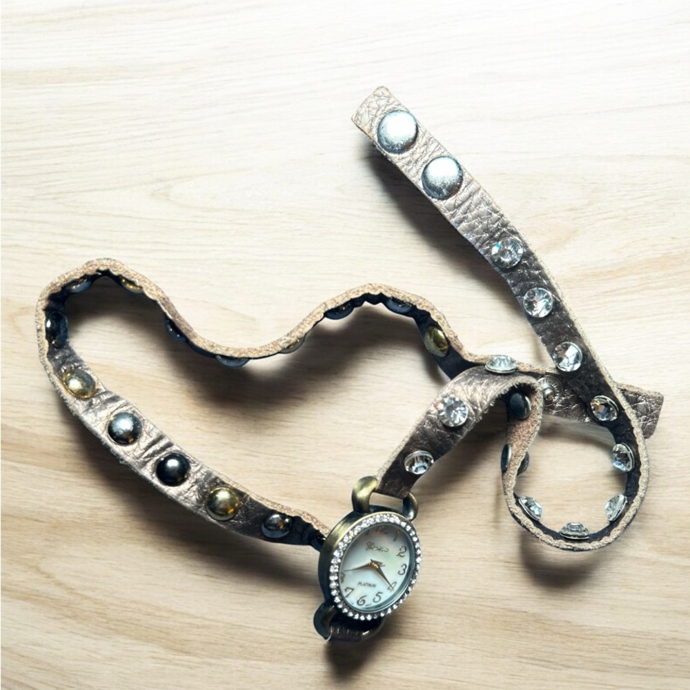 Early 90’s Geneva Platinum women's studded wrap-around watch.